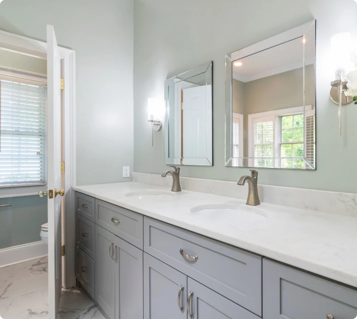 Gray double bathroom vanity with a white countertop and two mirrors