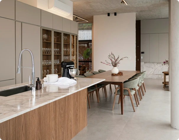 Modern kitchen with a wood island and tall glass-front cabinets